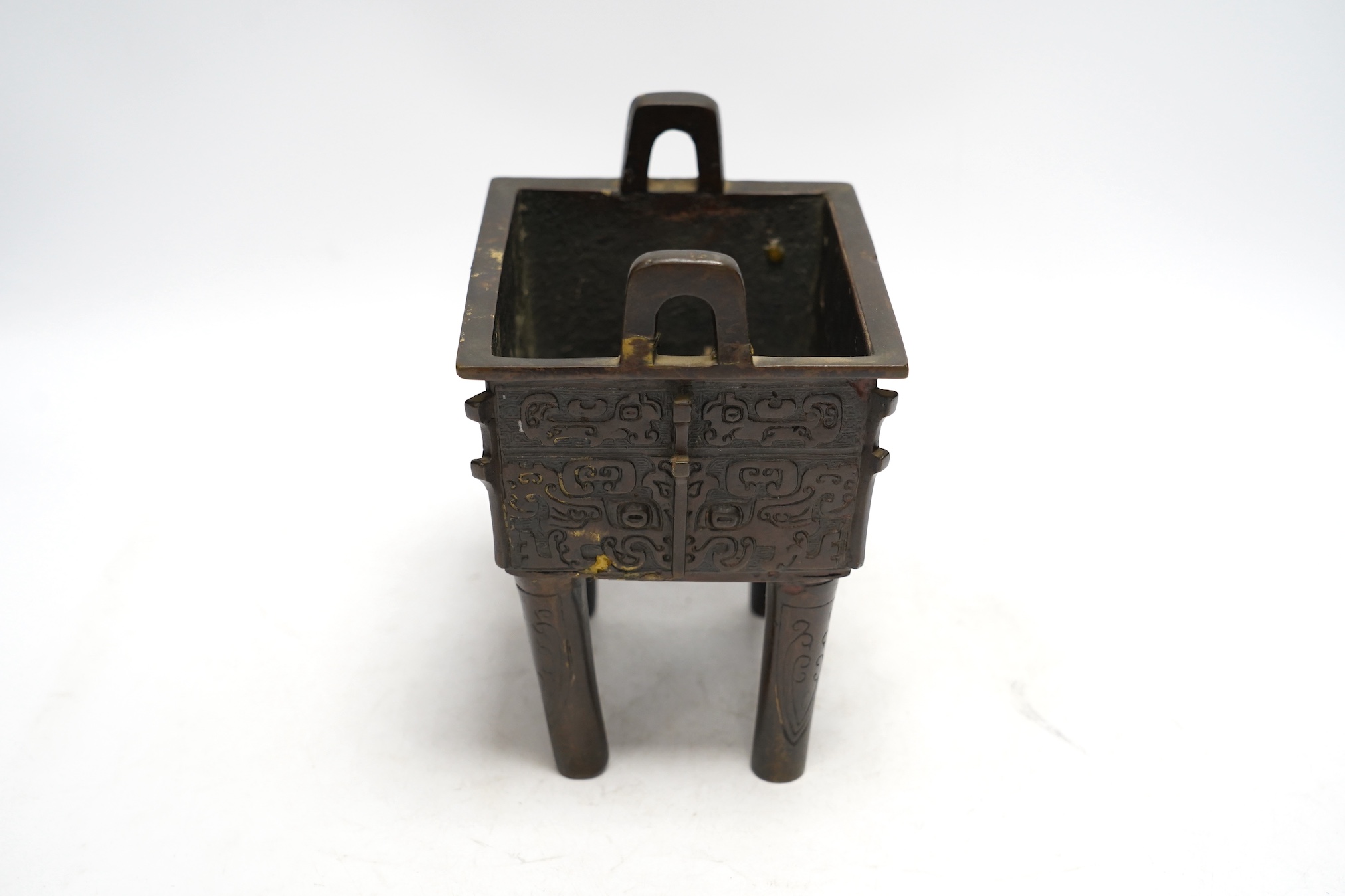 A Chinese archaistic bronze censer, fangding, Ming dynasty, repairs, 20cm